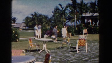 1961: Two Ladies Walking Across Backyard in Nassau, Bahamas
