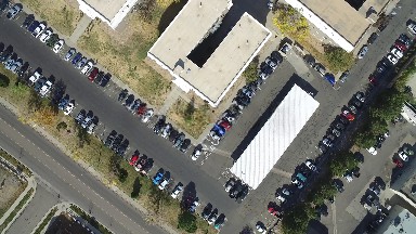 large area with lots of vehicles are in order and side by side in harmony