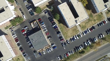 a birds eye view of a group of building roofs and parking lot COLORADO