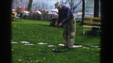 1961: a fisherman showing off his catch NOVI MICHIGAN