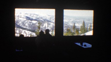 1961: people looking at mountains through a window in a restaurant ASPEN