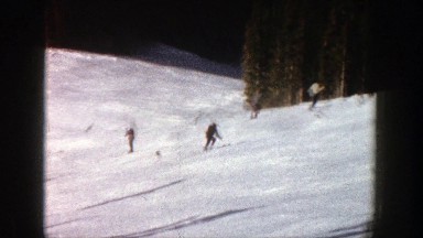 1961: people skiing from a steep hill near trees ASPEN COLORADO