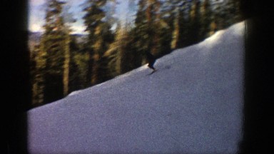 1961: skier jumping off a jump and racing down the hill ASPEN COLORADO