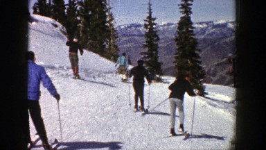 1961: a group of men or people sliding down a ski slope ASPEN COLORADO