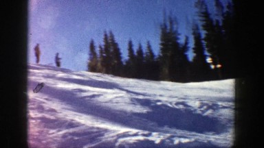1961: group of skiers launching one after another from top of hill ASPEN