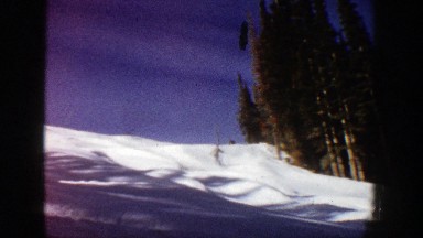 1961: a person skiing from a mountains near a large group of trees ASPEN