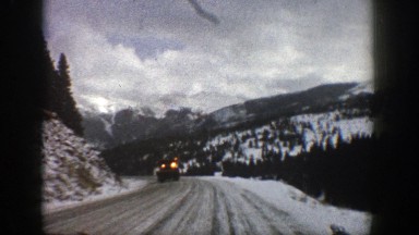 1961: passing a large dump truck on a snowy road while precariously driving on a
