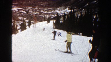 1961: skiing off a snowy mountaintop. ASPEN COLORADO