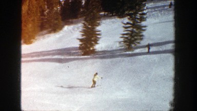 1961: people are having fun skiing in snow filled mountain ASPEN COLORADO