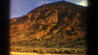1961: shot of a lonely bushy, yellow hill. ASPEN COLORADO