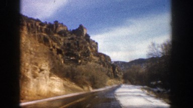 1961: driving on a wet road in the country. ASPEN COLORADO
