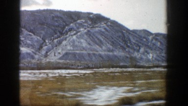 1961: driving next to a mountain. ASPEN COLORADO