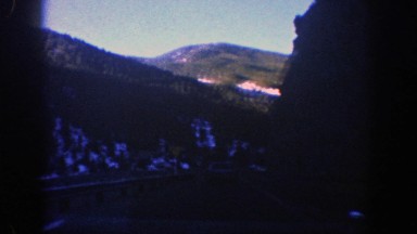 1961: Driving by a Yield Sign in the Mountains of Aspen Colorado