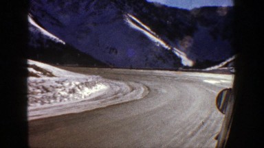 1961: Driving Around a Sharp Corner on a Snowy Mountain Road in Aspen, Colorado