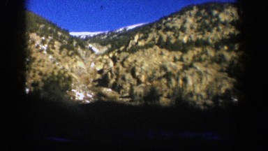 1961: a clear dark blue sky sits above a snowy mountain peak ASPEN COLORADO