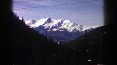 1961: breath-taking, snowcapped mountain view with mature trees ASPEN COLORADO