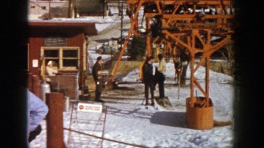 1961: skiers load into a small lift chair to go skiing ASPEN COLORADO