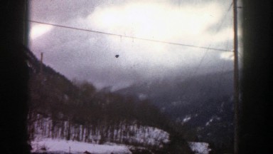 1961: power lines running across a snowy mountain view ASPEN COLORADO