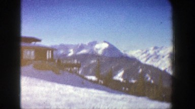 1961: house or lodge in an area where there is skiing nestled in between some