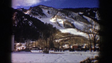 1961: hillside housing after the snowfall, clear sky and sunshine. ASPEN