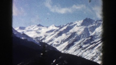 1961: magnificent mountain range covered with snow under the blue sky ASPEN