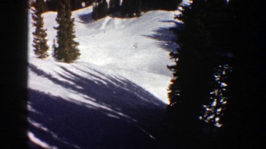 1961: traveling over a snowy mountain side with pine trees ASPEN COLORADO