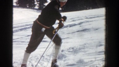 1961: a skateboarder climbs up and then proceeds to ski at a fast rate down a