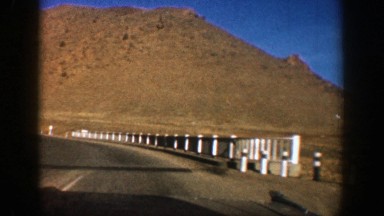 1961: driving on the road through mountains ASPEN COLORADO