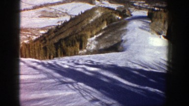 1961: Snowy Hill Perfect for Skiing with Long Shadows and Birds Circling