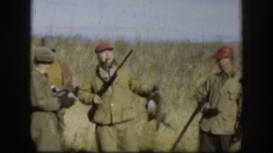 1958: Hunter Tosses Game Bird in Air and Pretends to Aim and Shoot