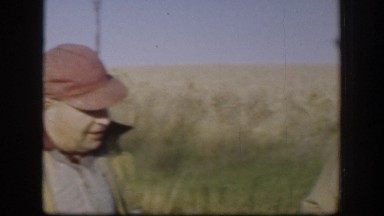 1958: Two Hunters Smoking Cigarette and Removing Cap After Hunting in Kansas