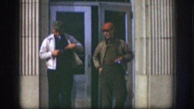 1958: two men walking and smoking KANSAS