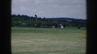 1958: airplane preparing to land on runway in wooded area. NEBRASKA