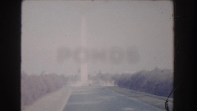 1960: city roads and traffic, lights and sculptures alongside the road.