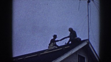 1958: Two Men Changing Clay Tiles on Roof of House in Nebraska