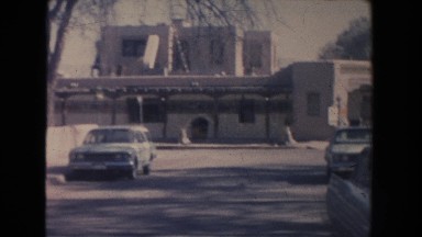 1951: Cars Parked on a Street and Adobe-Looking Buildings with Arches New Mexico