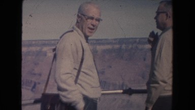 1962: a group of people seeing something from the top and talking each other.