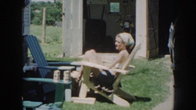 1958: Pretty Young Woman Sitting Outside With Her Dad Nebraska
