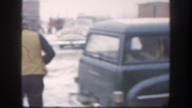 1958: a man gets off a motor vehicle carrying a long gun KANSAS