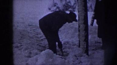 1958: man shoveling snow away from house NEBRASKA
