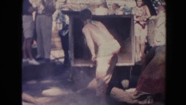 1961: African Men Paving Road in Hawaii with White Man Observing