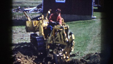 1958: Man Digging with Bucket Attachment on Dozer Nebraska
