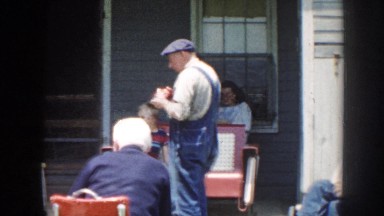 1958: a family relaxing outside talking together NEBRASKA
