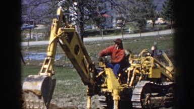 1958: man digging with bucket attachment on dozer NEBRASKA