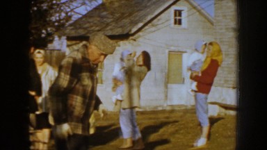 1959: a group of people of all ages collect and stack wood in a yard NEBRASKA