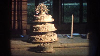 1959: wedding cake and people gathering at table NEBRASKA
