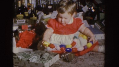 1955: baby playing with toy NEBRASKA