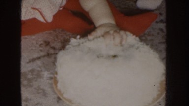 1955: a baby with a plate of rice then family in backyard. NEBRASKA