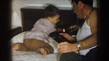 1957: a father and son reading books together NEBRASKA