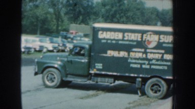 1959: a twelve second clip of a supply truck backed up to a ramp, deposited